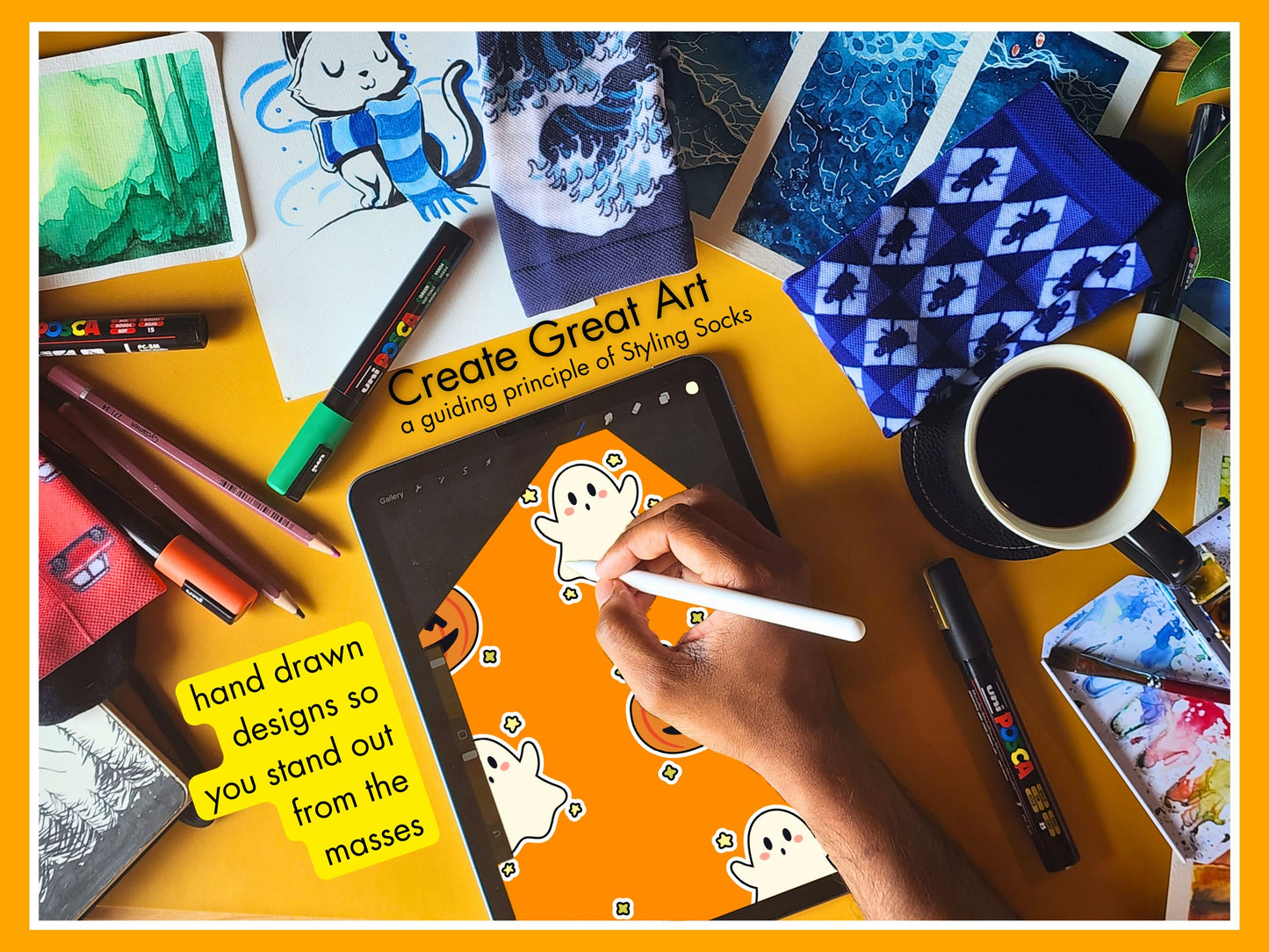 Artist drawing Halloween Ghost Pumpkin Socks design on a tablet with art supplies and coffee on a yellow surface