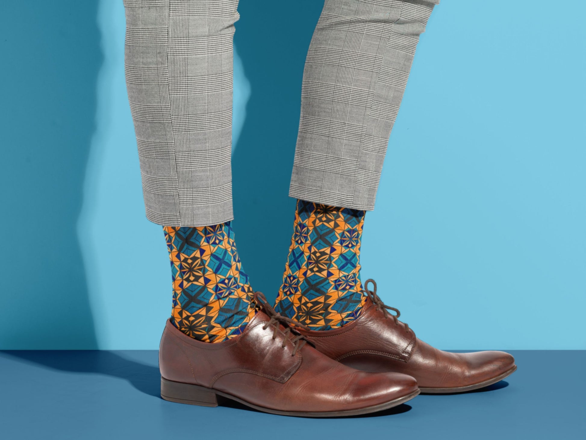 Abstract Art Socks styled with dress shoes in a lifestyle shot