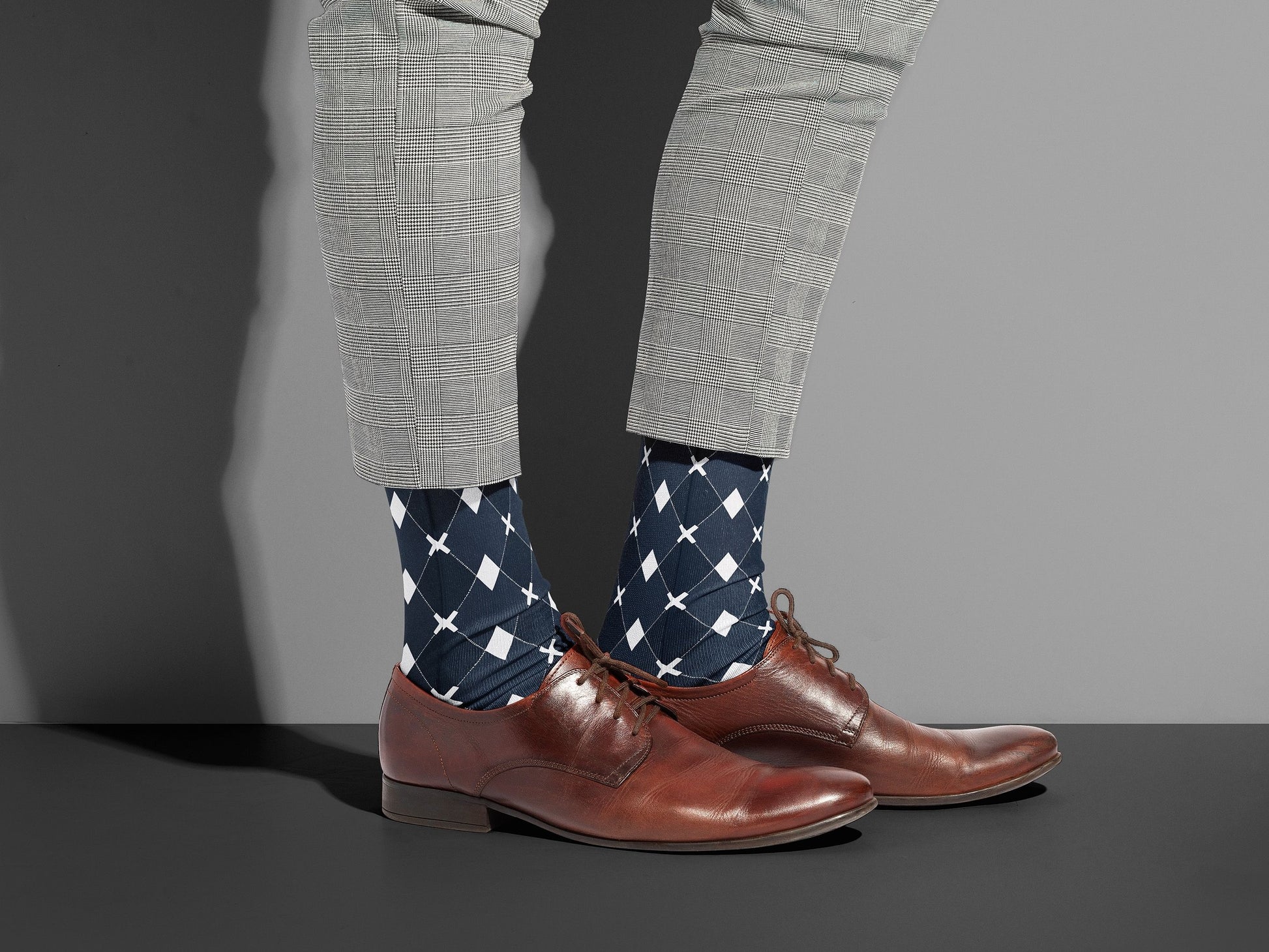Black Argyle Socks styled with dress shoes in a lifestyle shot