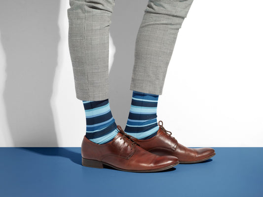 Luxury Striped Dress Socks – Navy with Color Pop styled with dress shoes in a lifestyle shot