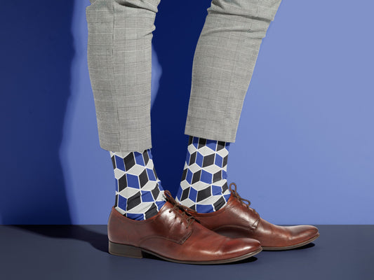 Navy Geometric Dress Socks styled with dress shoes in a lifestyle shot