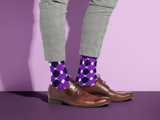 Purple & White Argyle Dress Socks styled with dress shoes in a lifestyle shot