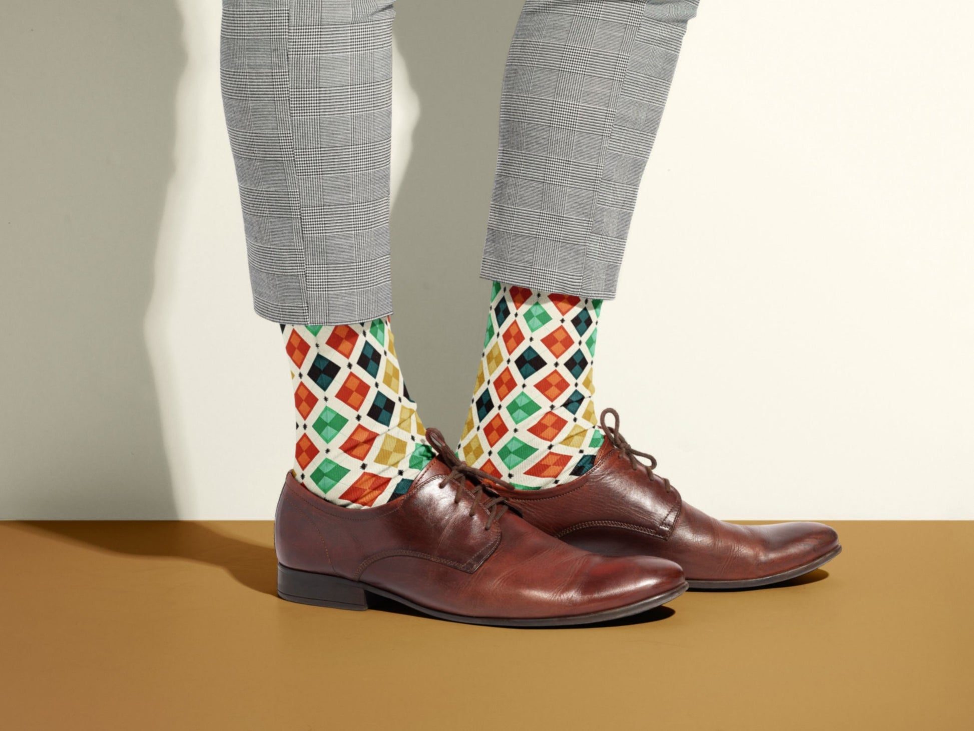 Vintage Geometric Socks styled with dress shoes in a lifestyle shot